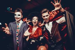 Three people dressed up in Halloween Costumes