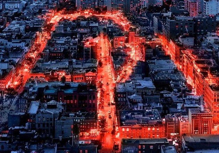 Aerial view of Hell's Kitchen streets lit up in red forming the Daredevil logo
