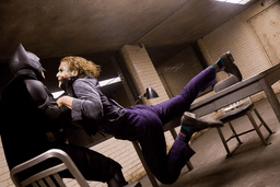 Batman hoisting Joker up from his collar