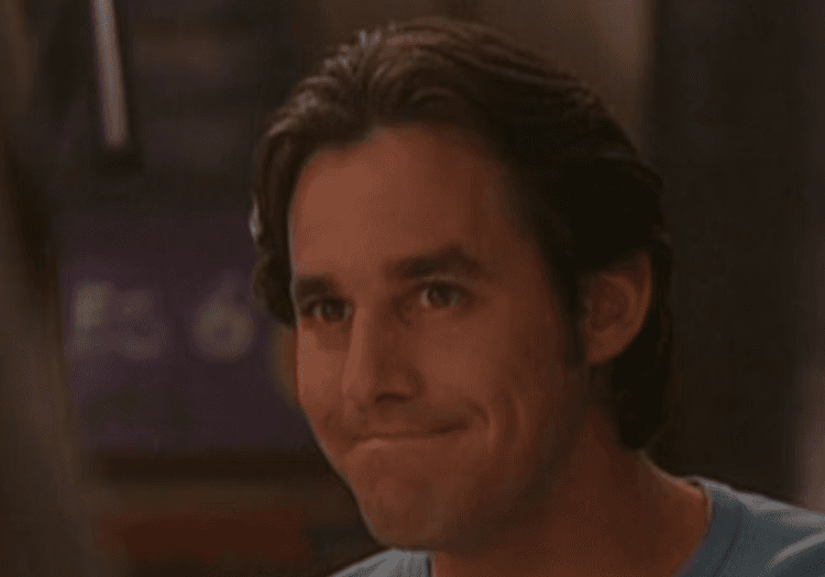 Nicholas Brendon in a still smiling slyly