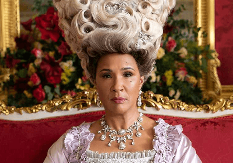 The Queen sitting with a serious face