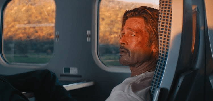 Brad Pitt sitting and watching in Bullet Train