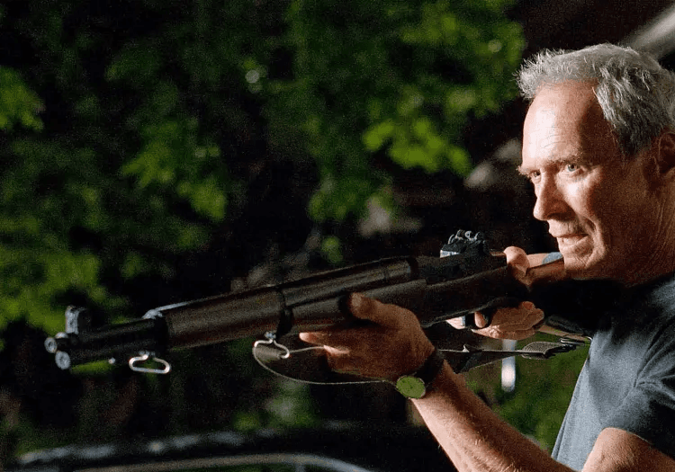 Clint Eastwood holding a rifle in Gran Torino
