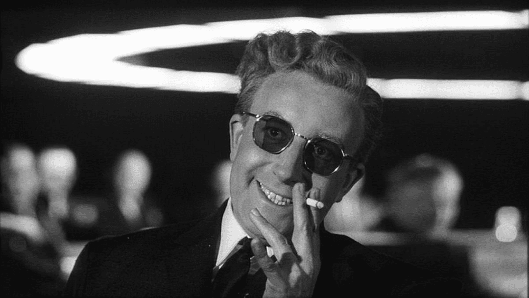 A man laughing and smoking