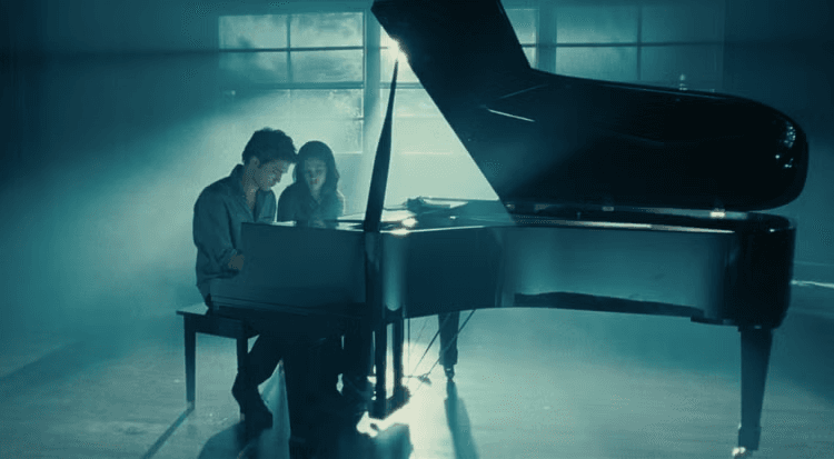 Edward playing on the piano for Bella