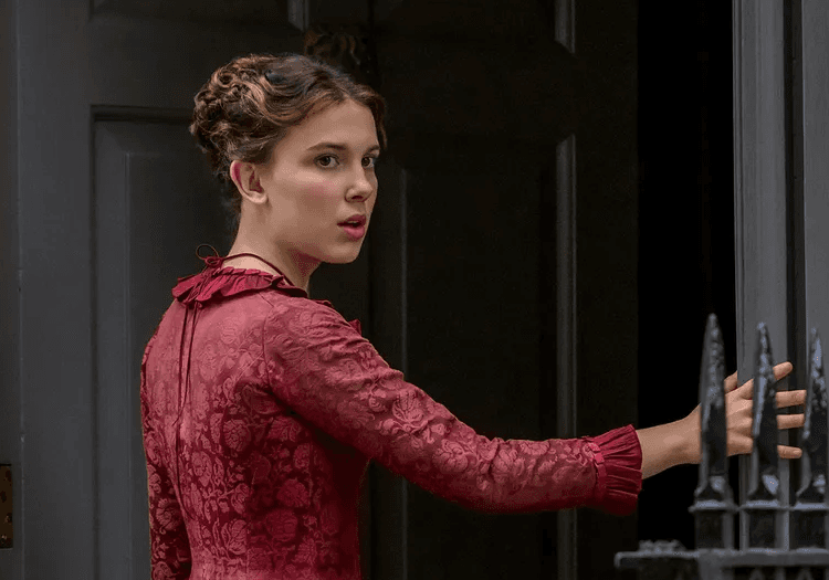 Enola Holmes wearing red gown