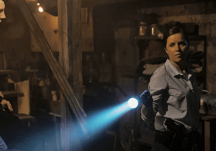 A woman holding a flashlight