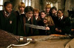 Harry Potter and others looking at the Nimbus 2000