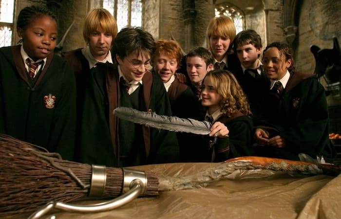 Harry Potter and others looking at the Nimbus 2000