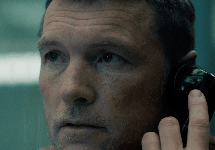 A man on the phone in I Will Find You