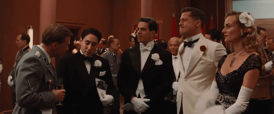 Brad Pitt, Christoph Waltz, and Diane Kruger standing in Inglourious Basterds