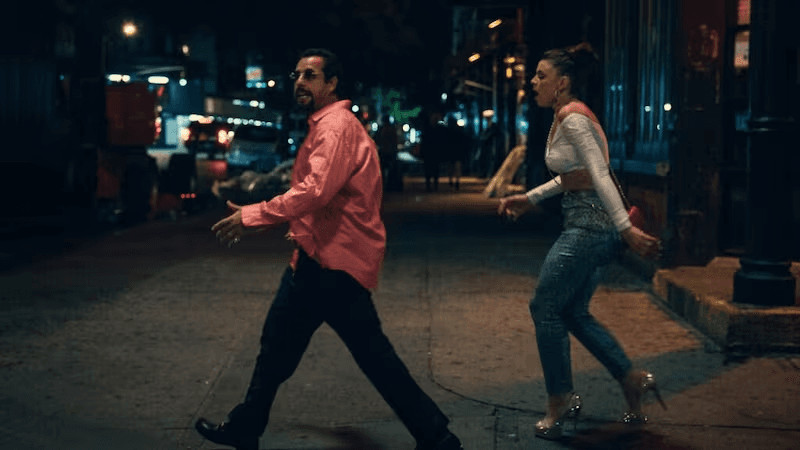 Two characters walking in Uncut Gems