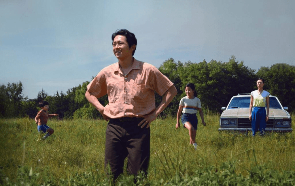 A family playing in the grass fields