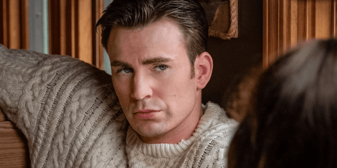 Chris Evans sitting in a diner