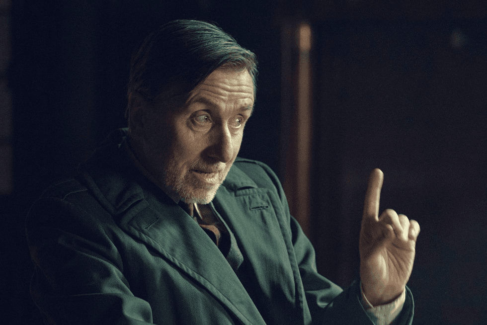 Tim Roth sitting with his finger raised in Peaky Blinders: The Immortal Man