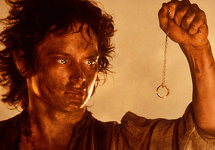 Frodo with the ring in fire in LOTR