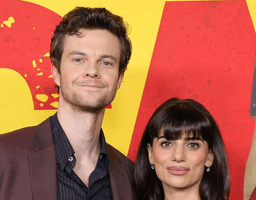 Jack Quaid and Claudia Doumit standing