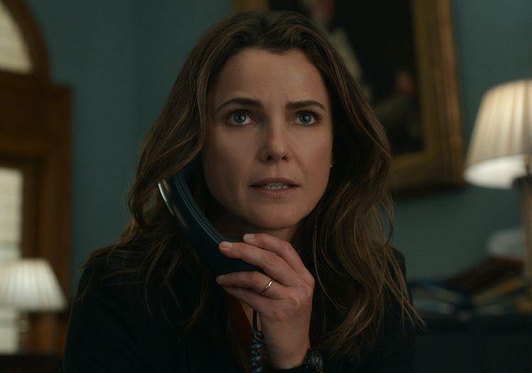 Kate Wyler on the phone looking worried 