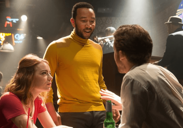 mia and sebastian talking to a man