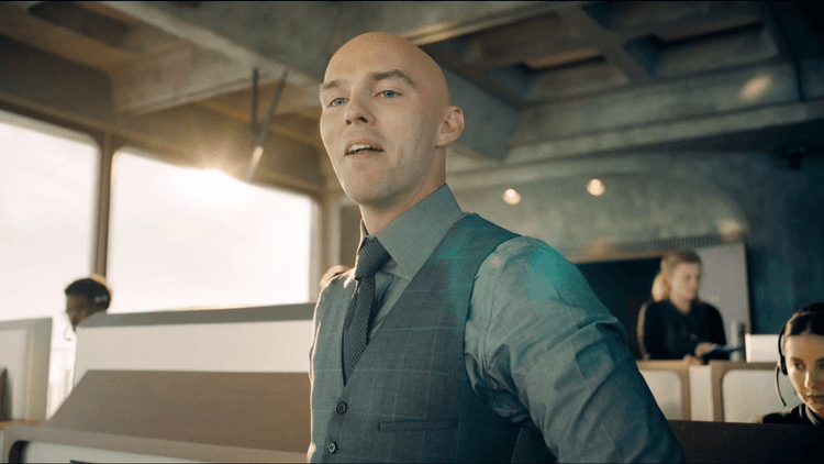 Lex Luthor looking down with a smug look in Superman