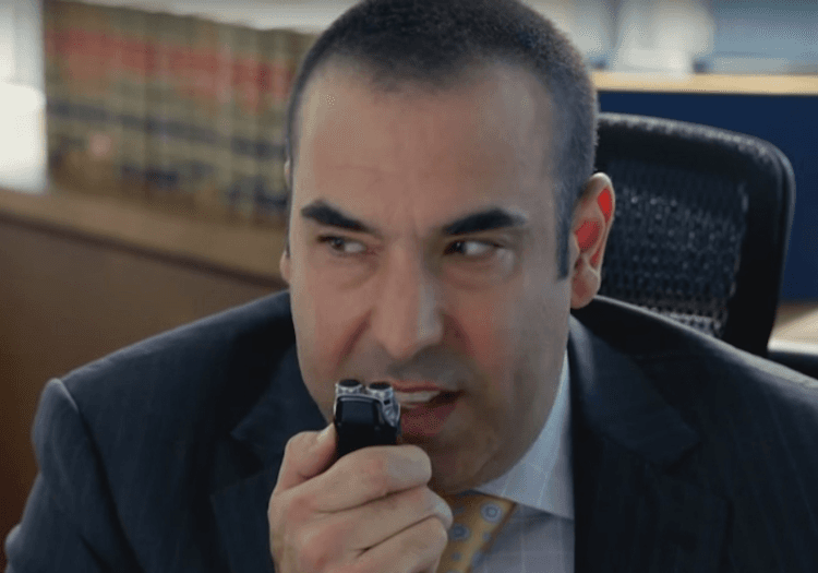 Louis Litt dictating in voice recorder 