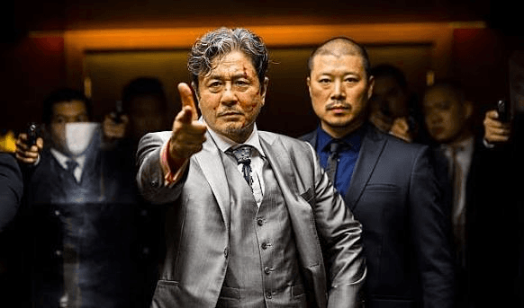 Mr Jang pointing at someone in the film