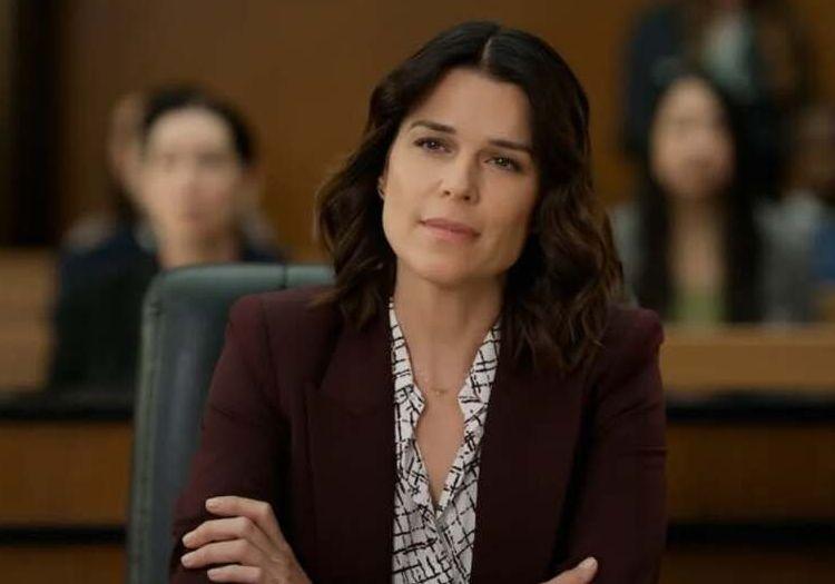 Maggie McPherson sitting in court with arms crossed