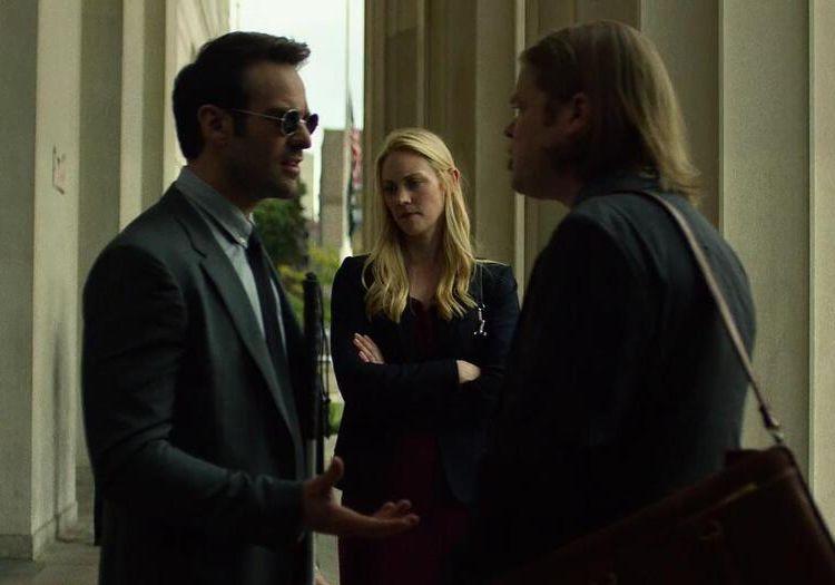 Matt Murdock, Karen Page, and Foggy Nelson having a serious conversation outside a building
