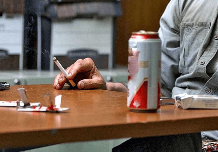 Matthew McConaughey smoking a cigarette in True Detective