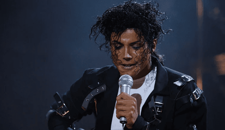 Michael holding an award