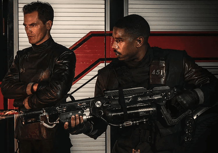 Michael B. Jordan holding a flamethrower