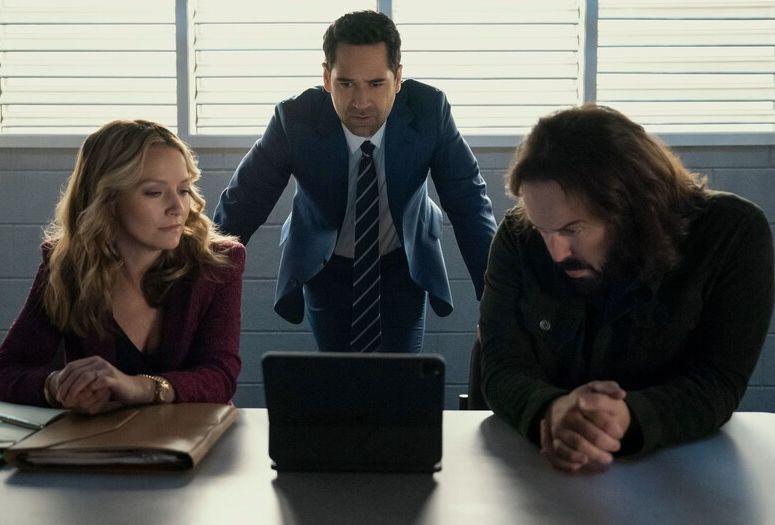 Mickey, Lorna and Cisco reviewing evidence on a tablet