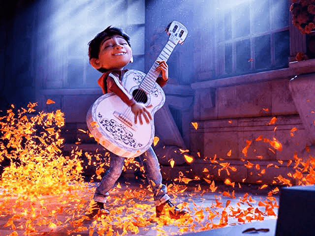 a guy playing a guitar in movie coco
