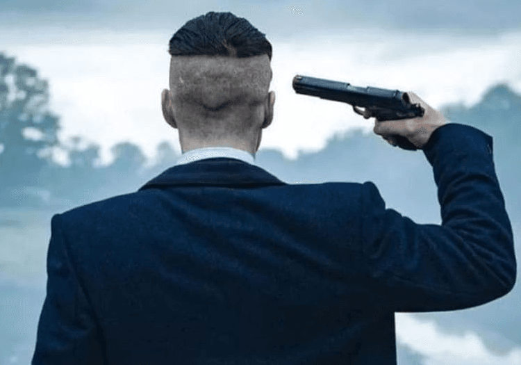 Tommy Shelby pulling a gun on himself in Peaky Blinders