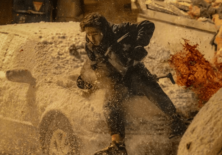 A man fallen on a car