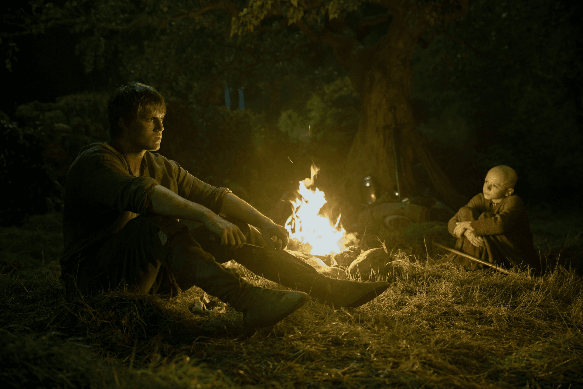 Ser Dunk and Egg sitting around a campfire