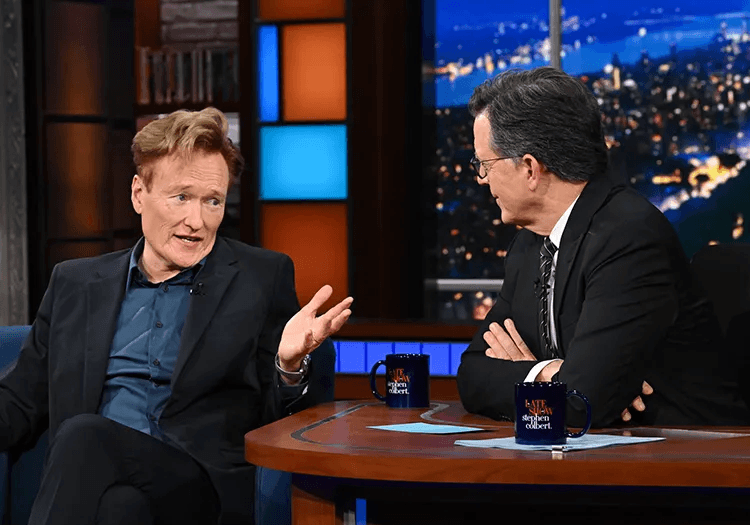 Stephen Colbert chatting with Conan O'Brien