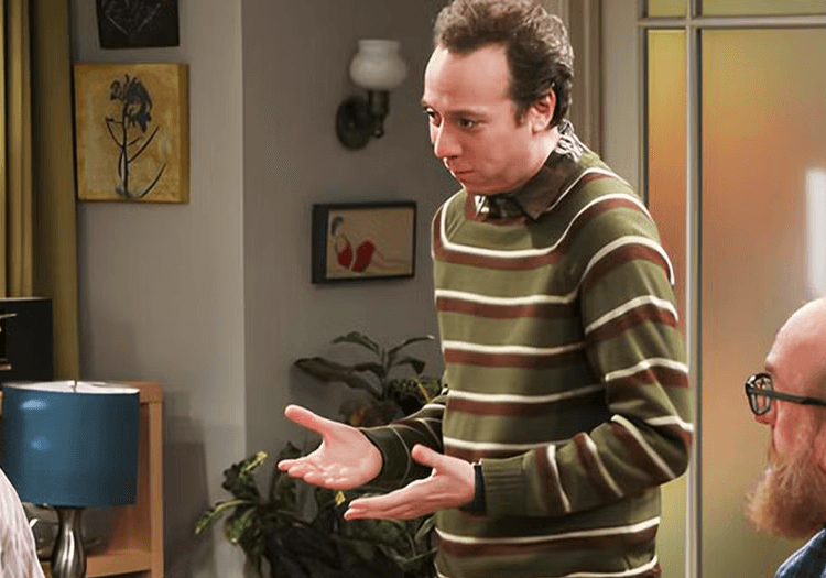 Stuart serving dinner in The Big Bang Theory