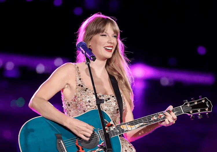 Taylor Swift holding a guitar