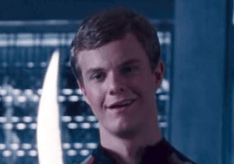 Jack Quaid standing in The Hunger Games