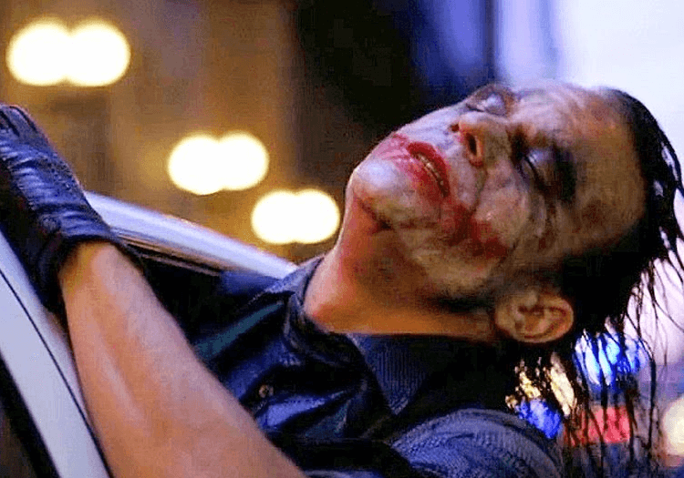 The Joker leaning out of a window