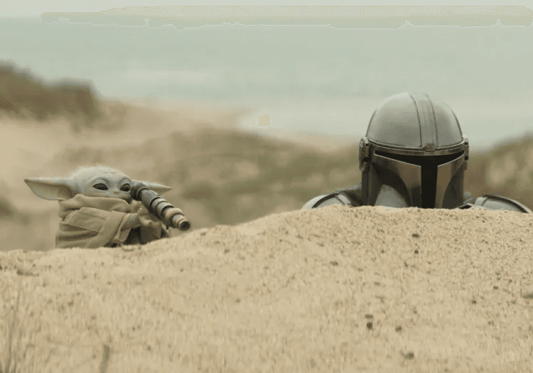 Grogu spying alongside The Mandalorian