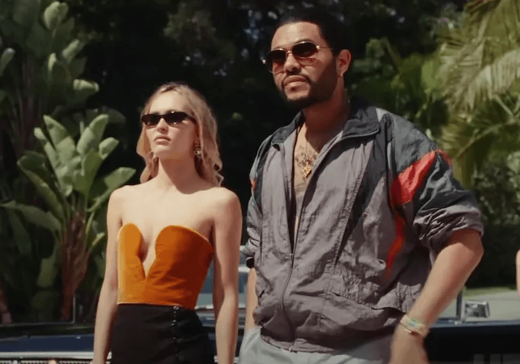 The Weeknd standing alongside Lily-Rose Depp