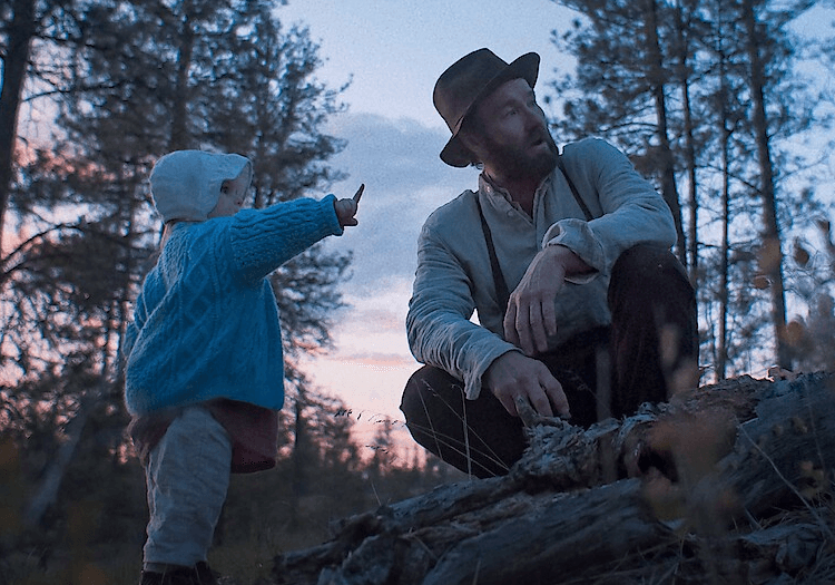 A man and a small kid in Train Dreams