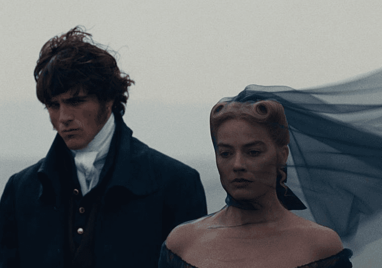 Jacob Elordi and Margot Robbie standing in Wuthering Heights