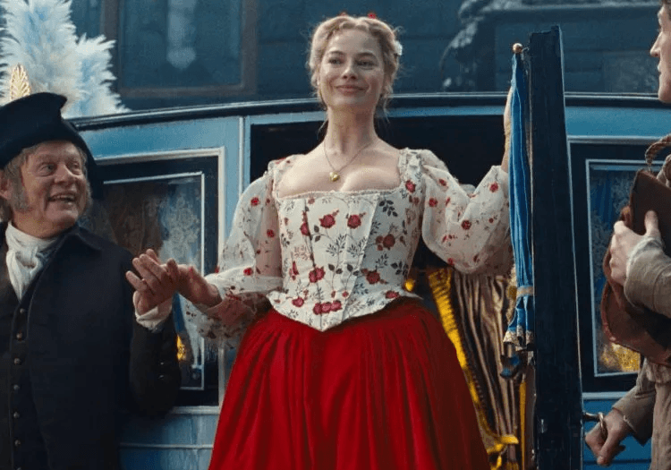 Margot Robbie smiling in Wuthering Heights