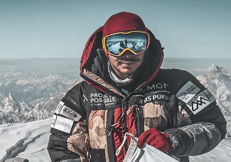 Nims Dai standing on the summit of K2